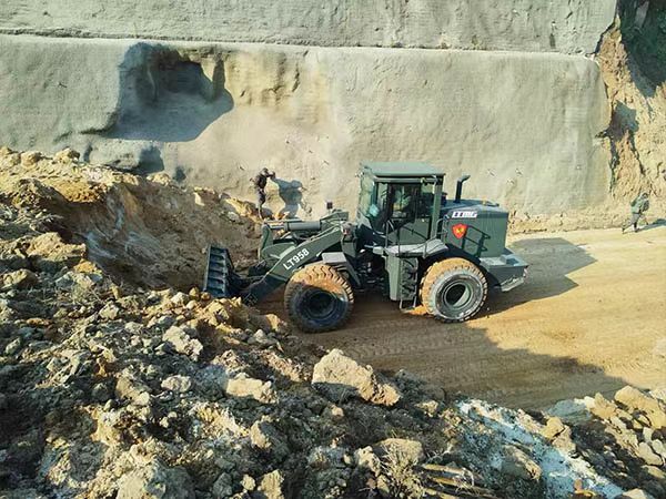 The loader LT958 is assisting in rescue Operations